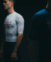 Two figures in Pedal Mafia x Red Bull Jerseys