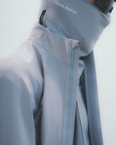 Man in Silver Jacket and Neck Warmer